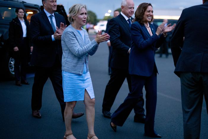 Second gentleman Doug Emhoff, Gwen Walz, vice presidential candidate Tim Walz and presidential candidate Kamala Harris walk across the tarmac at Philadelphia International Airport after their first rally together on Tuesday. 