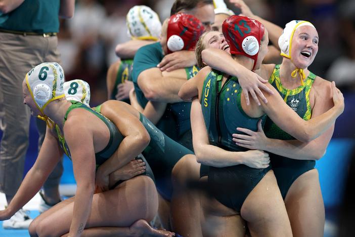 Members of Team Australia celebrate victory following the penalty shoot out in the Women's Semifinal match between Team Australia and Team United States on day thirteen of the Olympic Games Paris 2024 at Paris La Defense Arena on Aug. 8 in Nanterre, France.