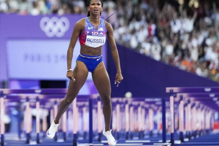 Masai Russell, of the United States, wins the women's 100-meter hurdles final at the 2024 Summer Olympics, Saturday, Aug. 10, 2024, in Saint-Denis, France. (AP Photo/Petr David Josek)