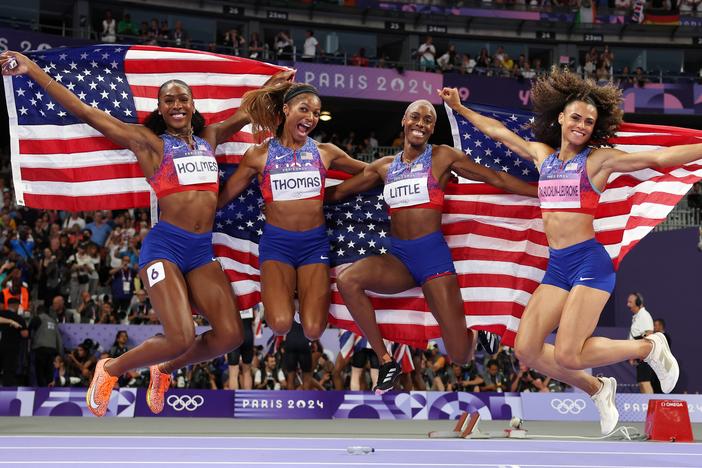 Shamier Little, Sydney McLaughlin-Levrone, Gabrielle Thomas and Alexis Holmes (L-R) of Team USA celebrate winning the Gold medal in the Women's 4 x 400m Relay Final on Saturday at the Stade de France.