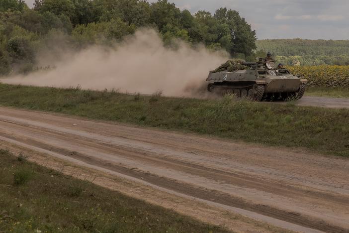 Ukrainian servicemen ride an armored fighting vehicle in the Sumy region, near Ukraine’s northeastern border with Russia on Sunday. Ukrainian troops in this area crossed into western Russia last week and have seized a large swath of territory.