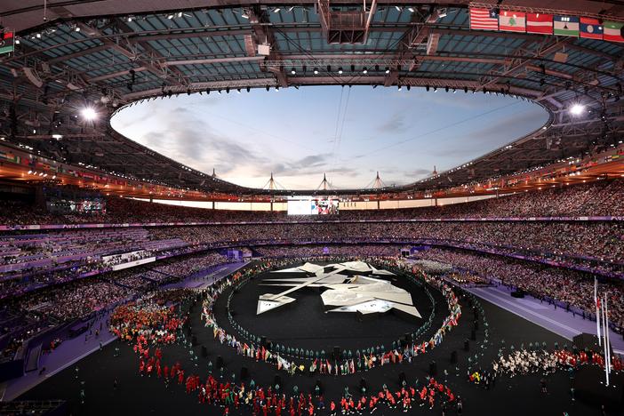 The Paris Olympics closing ceremony dazzles as flag bearers and athletes stream into the Stade de France on the final day of the Summer Games.