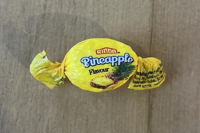 In this photo provided by the NZ Drug Foundation, a pineapple flavored candy filled with a potentially lethal dose of methamphetamine is displayed Tuesday  in Auckland, New Zealand.