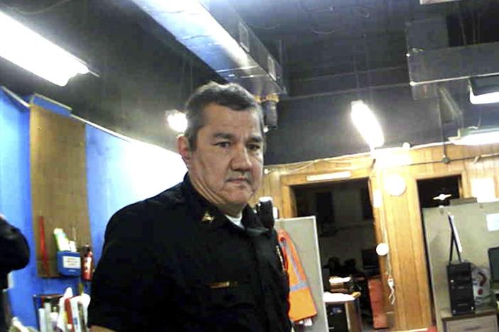 This image from Marion, Kan., Police Department body camera video provided by the McDonald Tinker law firm shows former Marion Police Chief Gideon Cody during his department's raid of the Marion County Record newspaper on Aug. 11, 2023, in Marion, Kan.