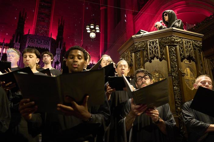 Louis Cole commands the pulpit as singers join in the performance at the First Congregational Church of Los Angeles.