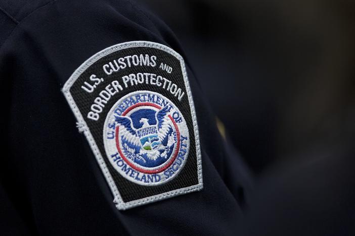 A customs agent wears a patch for the U.S. Customs and Border Protection agency on Oct. 27, 2017, at John F. Kennedy International Airport in New York.