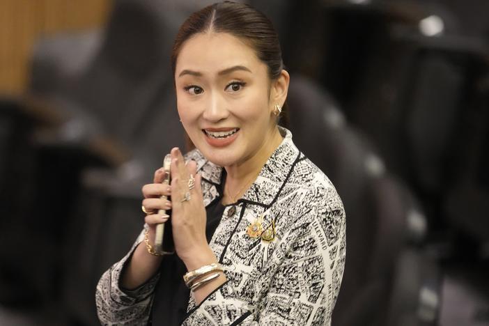 Paetongtarn Shinawatra, leader of Pheu Thai Party and daughter of Thailand's former Prime Minister Thaksin Shinawatra, smiles before a news conference in Bangkok on Thursday.