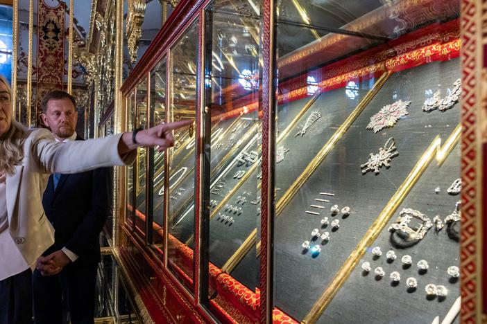 Marion Ackermann, director general of the Dresden State Art Collections, points to a display case with some of the recovered jewelry during a press event at the Green Vault in Dresden, Germany, on Tuesday.