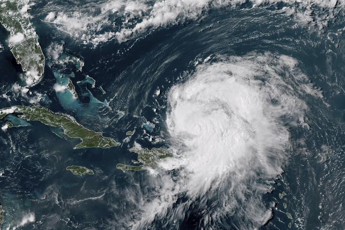 This GOES-16 GeoColor satellite image taken at 4 p.m EDT and provided by National Oceanic and Atmospheric Administration (NOAA) shows Hurricane Ernesto northwest of San Juan, Puerto Rico and moving over open waters, Wednesday, Aug. 14, 2024.