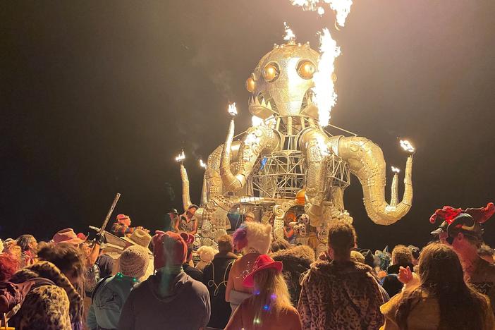 Attendees dance during the annual Burning Man Festival in the early morning of Sept. 5, 2023. Thousands of revelers were stuck in the mud for days last year.