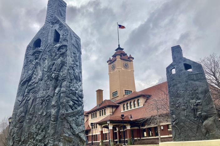 Sculptures representing charred chimneys rising from the smoldering rubble of burned-out buildings make up the centennial memorial of the 1908 race riot, entitled <em>Acts of Intolerance</em> by Preston Jackson, on March 22, 2023, in Springfield, Ill. 