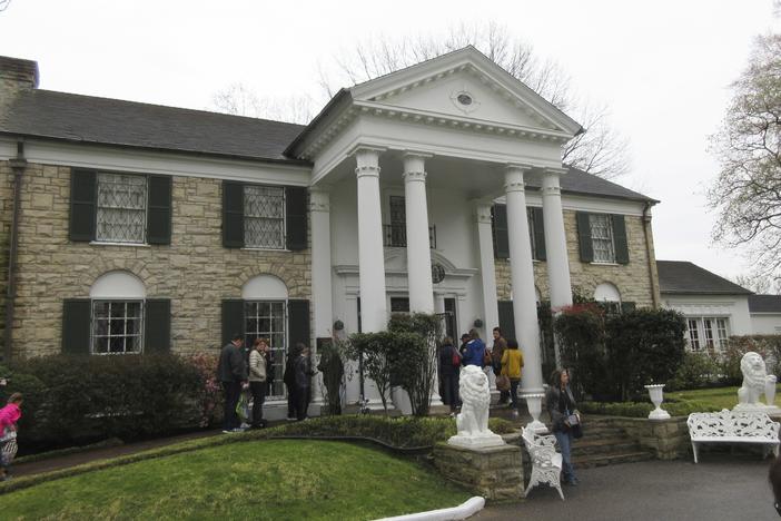 This March 13, 2017, photo shows visitors getting ready to tour Graceland in Memphis, Tenn. 