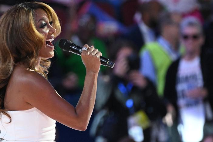 Mickey Guyton sings on the first day of the Democratic National Convention in Chicago.