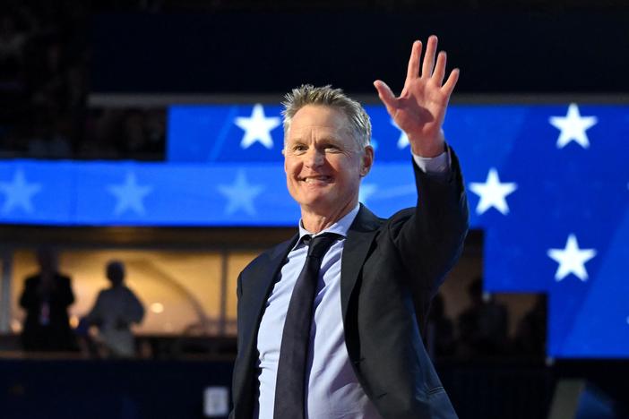 Golden State Warriors and Team USA head coach Steve Kerr walks on stage to speak on the first day of the Democratic National Convention in Chicago, Illinois, on August 19, 2024.