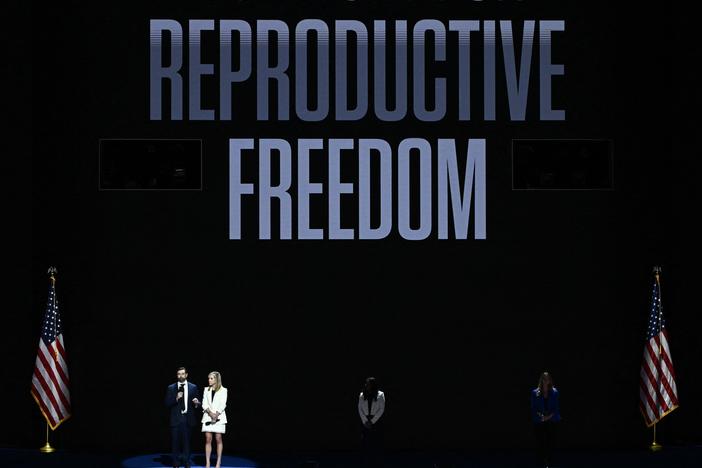 Amanda Zurawksi and Josh Zurawski (L) speak about reproductive rights on the first day of the Democratic National Convention in Chicago, Illinois, on August 19, 2024.