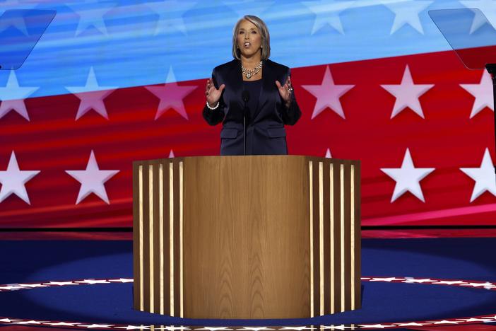 New Mexico Gov. Michelle Lujan Grisham speaks on stage during the second day of the DNC. 