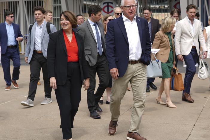 U.S. Senator Amy Klobuchar, left, and Minnesota Gov. Tim Walz, right, arrive at a press conference ahead of the U.S. Gymnastics Olympic Trials on June 24, 2024, in Minneapolis.