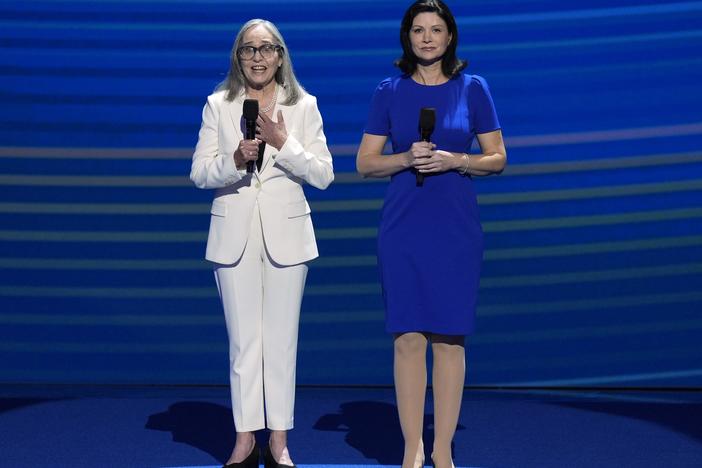 Amy Resner, former prosecutor and friend of Vice President Kamala Harris, left, speaks as Karrie Delaney, director of federal affairs at the Rape, Abuse & Incest National Network, listens at the DNC.