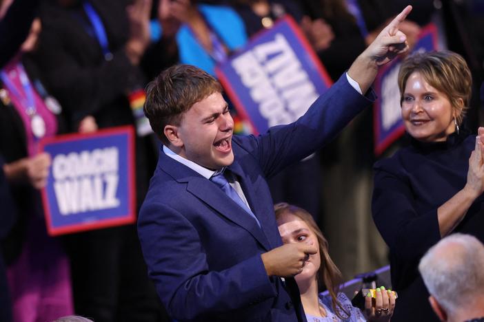 Gus Walz cheers as his father, Minnesota Gov. Tim Walz, gave a shoutout to his family while accepting the Democratic vice presidential nomination on the third day of the Democratic National Convention in Chicago.