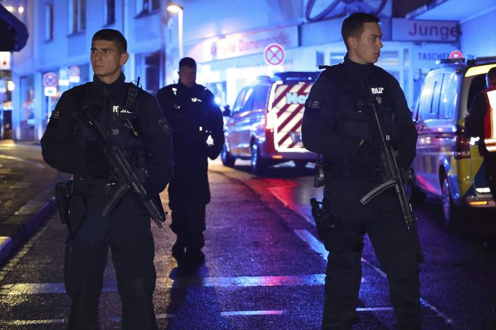 Police and ambulances near the scene where people were killed and injured in an attack at a festival in Solingen, western Germany, the German dpa news agency reported, Friday, Aug. 23, 2024.
