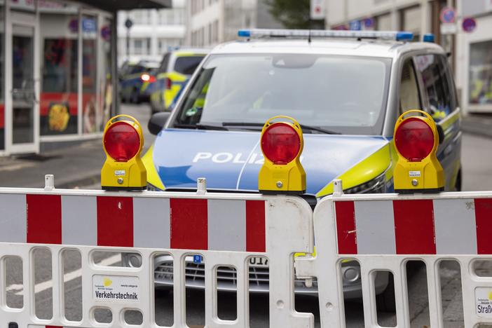 Police emergency vehicles stand at a cordon in the city center of Solingen, Germany, in the early morning of Sunday, Aug. 25, 2024, following Friday's deadly attack at the city's 650th anniversary celebrations.