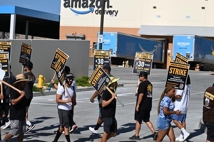 Amazon delivery drivers and dispatchers picket the company's Palmdale, Calif., warehouse and delivery center on July 25, 2023. 
