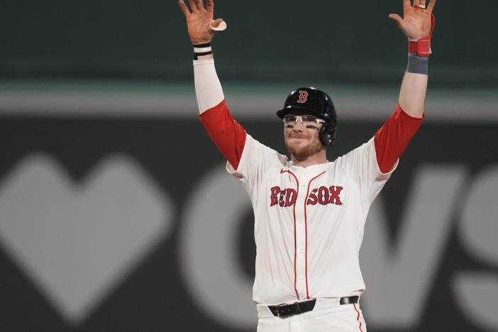 The Boston Red Sox's Danny Jansen celebrates after hitting an RBI single during the eighth inning of a baseball game against the Texas Rangers at Fenway Park, on Aug. 14 in Boston. 