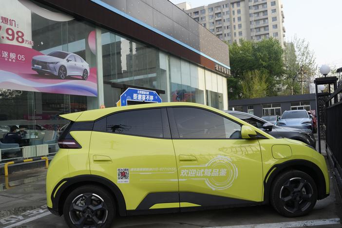 A Seagull electric vehicle from Chinese automaker BYD for test driving is parked outside a showroom in Beijing on April 10. The tiny, low-priced electric vehicle called the Seagull has American automakers and politicians trembling. The car, launched last year by Chinese automaker BYD, sells for around $12,000 in China. But it drives well and is put together with craftsmanship that rivals U.S.-made electric vehicles that cost three times as much. Tariffs on imported Chinese vehicles probably will keep the S…