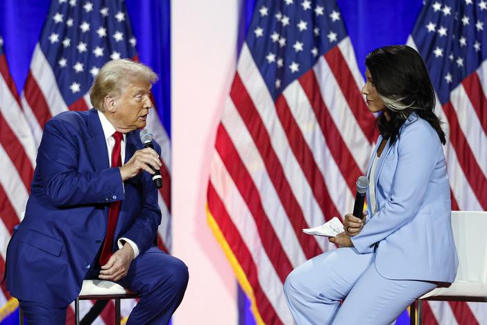 Former President and Republican presidential candidate Donald Trump (L) speaks during a town hall meeting moderated by former Rep. Tulsi Gabbard at La Crosse Center in La Crosse, Wisc., on Aug. 29, 2024. 