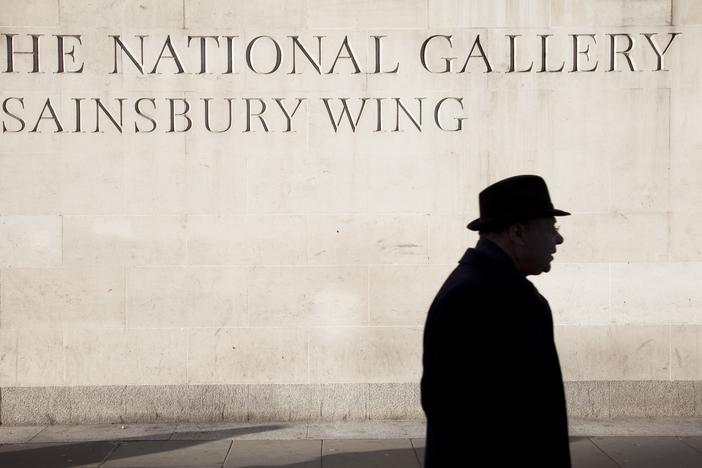 A person walks by the Sainsbury Wing of the National Gallery, London.