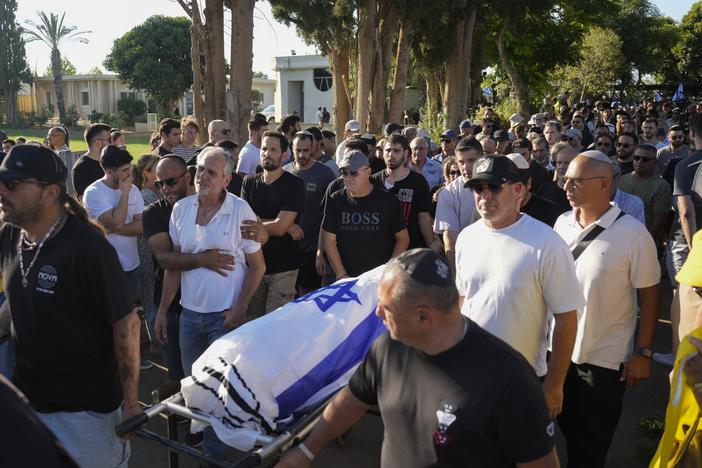 Relatives and friends attend the funeral of slain hostage Almog Sarusi, who was killed in Hamas captivity in the Gaza Strip, at a cemetery in Ra'anana, Israel, Sunday, Sept. 1, 2024.
