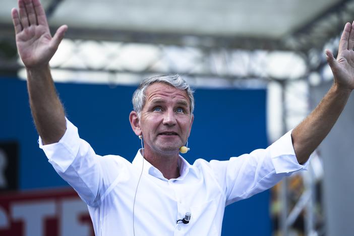 Bjoern Hoecke top candidate in Thuringia of the far-right Alternative for Germany, AfD, party waves to supporters during an election campaign rally in Suhl, Germany, Aug. 13.