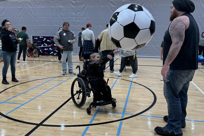 Skills on Wheels, an Indiana University program, features a carnival where participants can play games, eat food, and connect with manufacturers for free wheelchair repairs. 