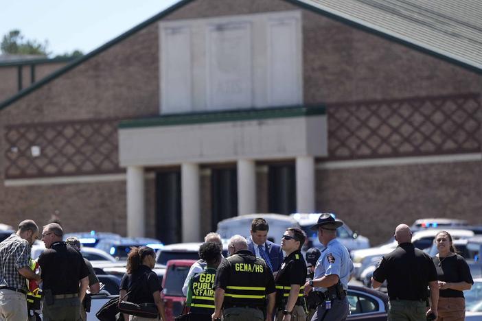 Law enforcement officers and first responders respond to Apalachee High School in Winder, Ga., on Wednesday, after a shooting was reported.