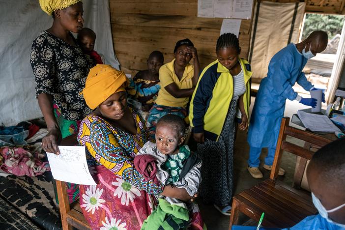 A doctor discusses treatment for mpox with the mother of an infected infant at the Kavumu hospital in the Democratic Republic of Congo. For 18 months, the Congolese have struggled to control an epidemic of the disease without the benefit of vaccines.  The majority of cases and deaths have been in children.  