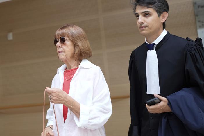 Gisèle Pélicot (left) arrives in the Avignon court house, in Avignon, southern France, on Thursday.