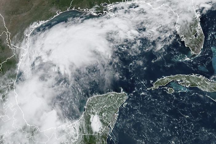 A satellite image shows a tropical disturbance in the Gulf of Mexico on Sunday that formed into Tropical Storm Francine on Monday.