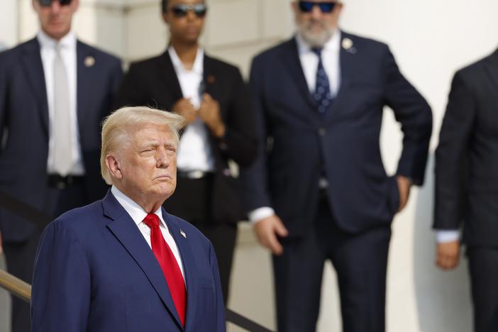 Republican presidential nominee, former President Donald Trump looks on during a wreath laying ceremony at the Tomb of the Unknown Soldier at Arlington National Cemetery on August 26, 2024 in Arlington, Virginia.