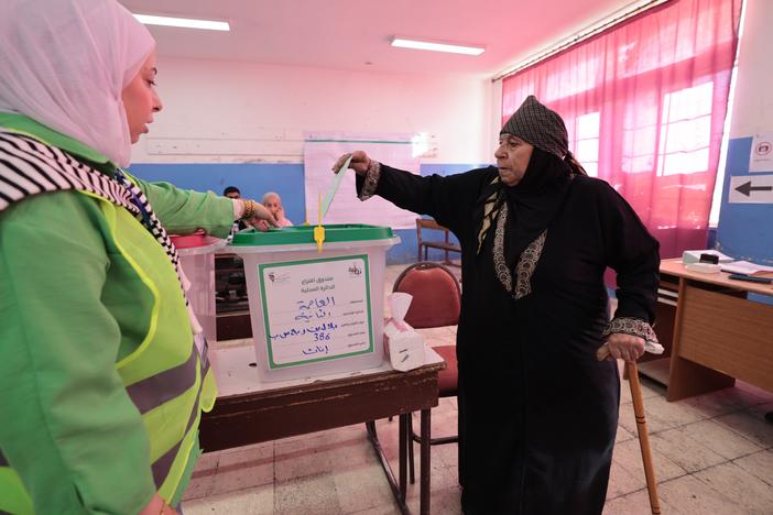 An Jordanian citizen votes in historic elections for the Parliament of Jordan's 138-seat lower house on Tuesday in Amman, Jordan. Voters are deciding their representatives in the 20th Lower House of Parliament. 