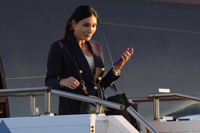 Laura Loomer arrives with Donald Trump at Philadelphia International Airport on Tuesday for the presidential debate.