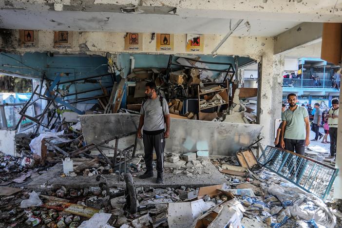 Civil defense teams and others carry out search and rescue operations after an Israeli strike on a school that was sheltering families at Nuseirat Refugee Camp in the Gaza Strip on Wednesday.