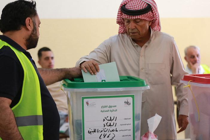 A Jordanian man votes in parliamentary elections at a polling station in al-Salt near the capital Amman on Tuesday.