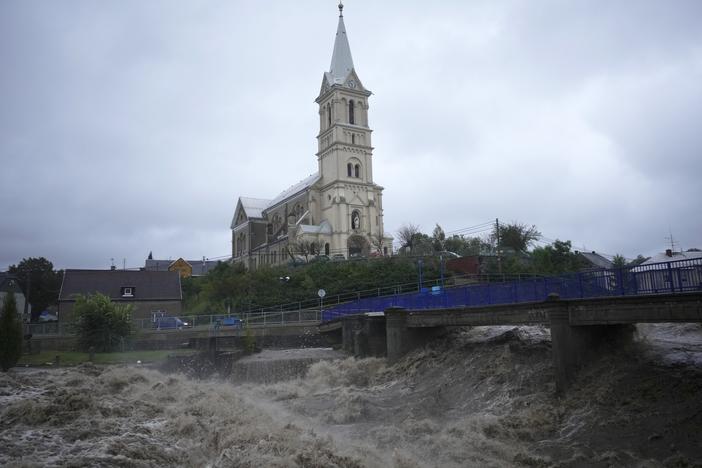 The Bela River flows past a church during floods in Mikulovice, Czech Republic, Saturday, Sept. 14, 2024.