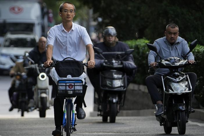 Motorists drive during the morning rush hour in Beijing on Friday.