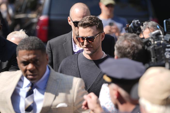 Justin Timberlake (center) walks into court for a hearing Friday in Sag Harbor, N.Y.