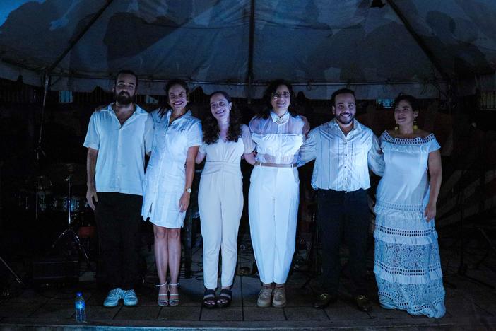 Pianist Daniela Santos, second from left, with the ensemble she was performing with when one of Puerto Rico's frequent power outages interrupted the Aug. 24 concert she'd worked six years to debut. Afterward, the musicians posed for a photo illuminated by cellphones from the audience.