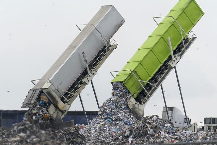 Garbage is unloaded into the Pine Tree Acres Landfill in Lenox Township, Mich., on July 28, 2022. State bans on commercial food waste have been largely ineffective, researchers found.