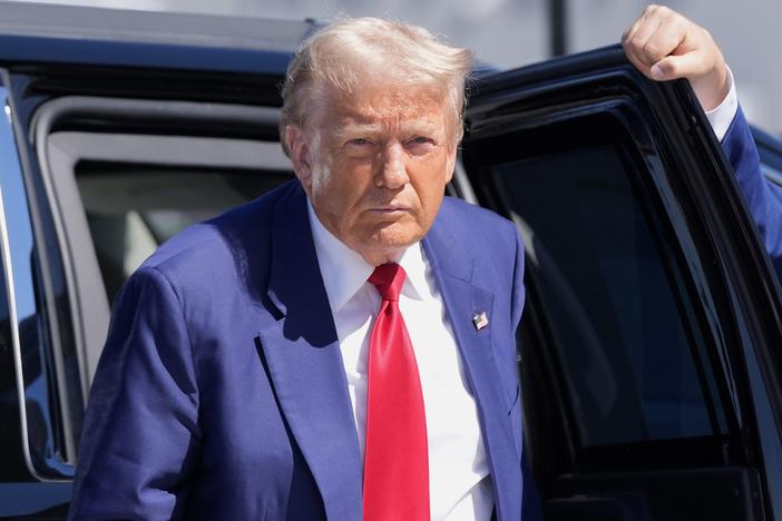 Republican presidential nominee, former President Donald Trump, arrives at Harry Reid International Airport to board a plane after a campaign trip on Saturday in Las Vegas.