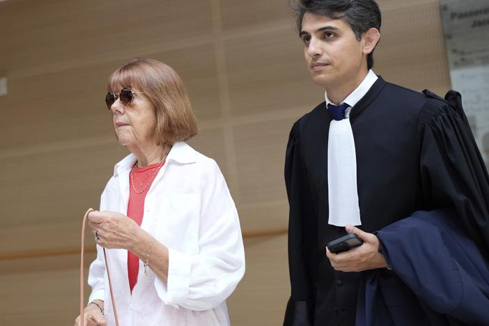Gisele Pelicot, left, arrives in the Avignon court house, in Avignon, southern France, Thursday, Sept. 5, 2024.