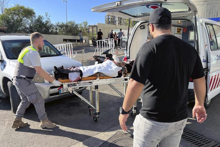 Civil Defense first-responders carry a wounded man whose handheld pager exploded at al-Zahraa hospital in Beirut, Lebanon, Tuesday, Sep. 17, 2024.